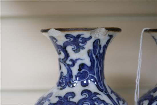 A pair of Chinese blue and white ginger jars and covers and a pair of vases